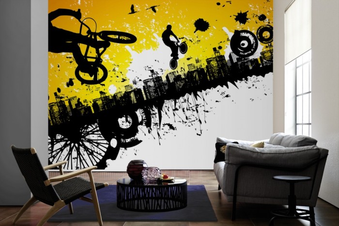 Im Wohnzimmer die Design-Fototapete BMX Fahrer in der Stadt, Artwork für Kinder auf einer großen Wand tapeziert. Die Design-Fototapete BMX Fahrer in der Stadt, Artwork für Kinder ist als Vlies-Fototapete im Wohnzimmer leicht zu tapezieren.