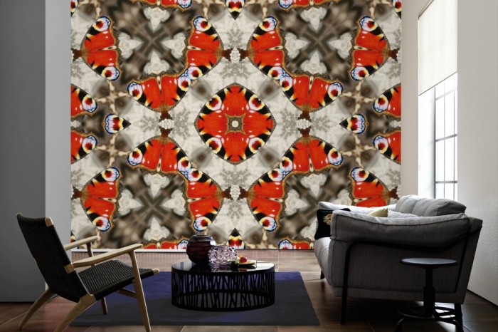 Im Wohnzimmer die Designer-Fototapete Kaleidoskop Schmetterling, Artwork by Mylumi auf einer großen Wand tapeziert. Die Designer-Fototapete Kaleidoskop Schmetterling, Artwork by Mylumi ist als Vlies-Fototapete im Wohnzimmer leicht zu tapezieren.