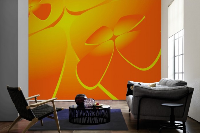 Im Wohnzimmer die Design-Fototapete 3D-Geometrie plastische Formen Orange auf einer großen Wand tapeziert. Die Design-Fototapete 3D-Geometrie plastische Formen Orange ist als Vlies-Fototapete im Wohnzimmer leicht zu tapezieren.