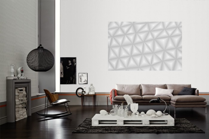 Die Design-Fototapete 3D-Geometrie graue Dreiecke als Wandbild im Wohnzimmer. Die Vlies-Design-Fototapete 3D-Geometrie graue Dreiecke verschönert als Wandbild Deine Wand.