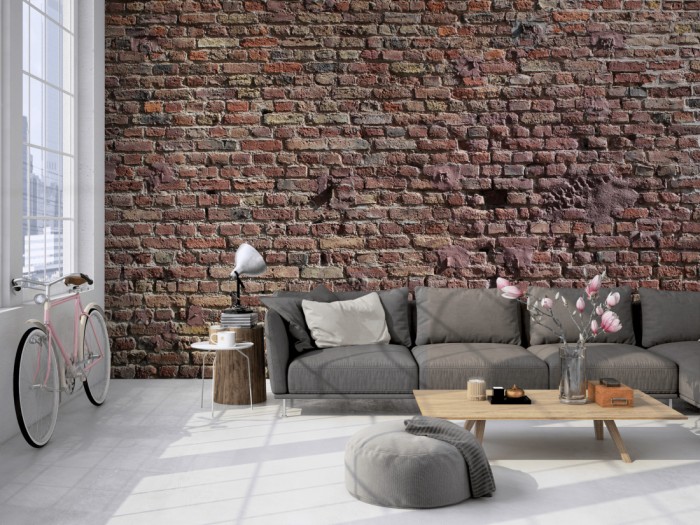 Die Fototapete Ziegel Wand, Steine im Sonnenschein auf einer großen Wand im Loft tapeziert. Die Fototapete Ziegel Wand, Steine im Sonnenschein wird individuell auf Deine Wand angepasst.