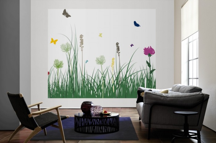 Die Design-Fototapete Blumenwiese Frühling, Artwork als große Bildtapete im Wohnzimmer. Als Bildtapete ist die Design-Fototapete Blumenwiese Frühling, Artwork ein besonderes Highlight auf Vliestapete.